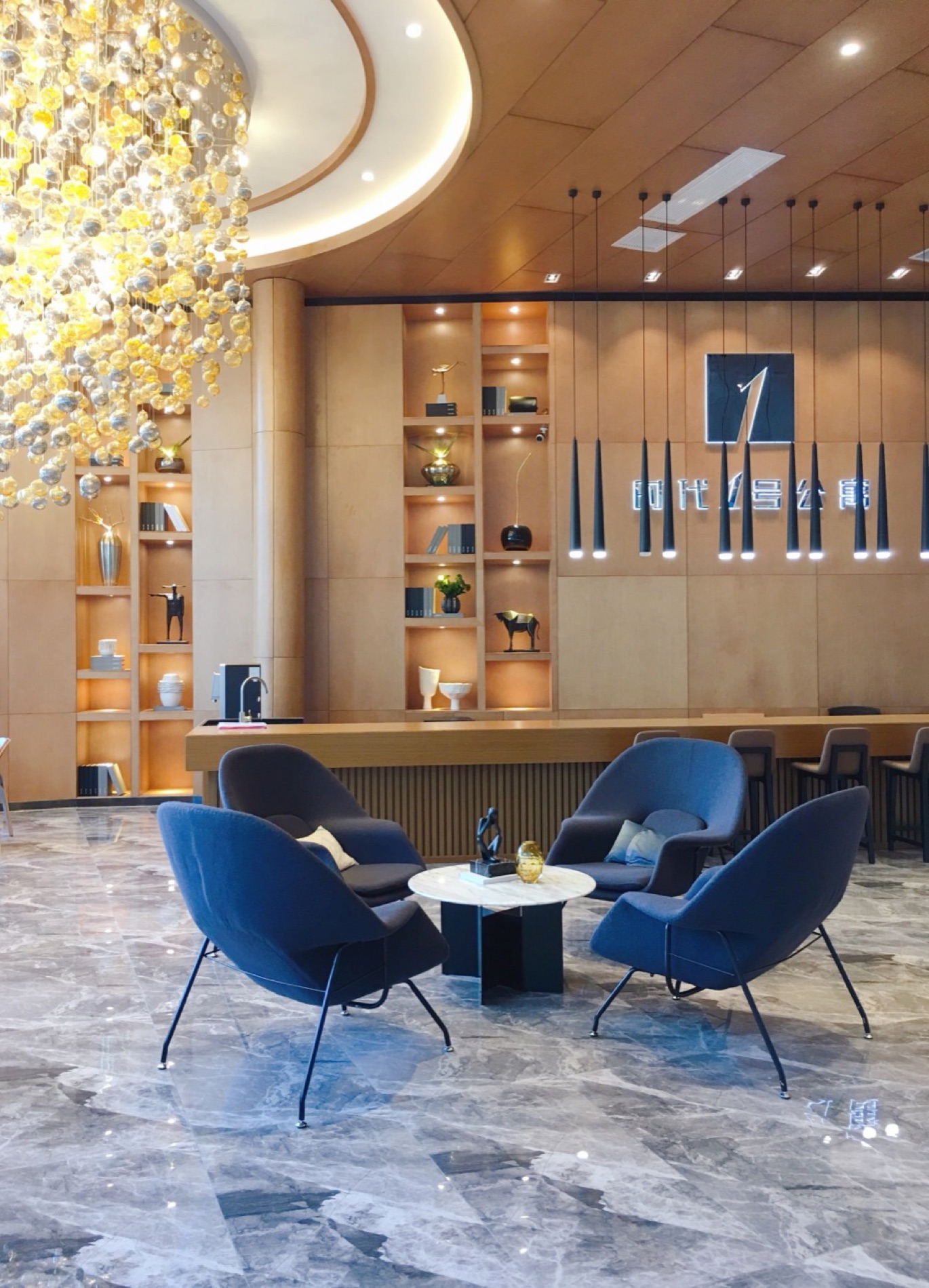 Dianchi Times sales centre, timber veneer wall and display shelving